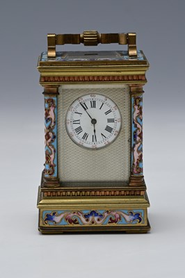 Lot 555 - A French lacquered brass and champlevé enamel...