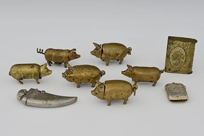 Lot 531 - Two patinated brass Pig vesta cases, a similar...