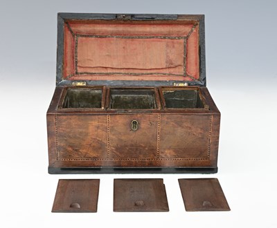 Lot 536 - A Georgian walnut three compartment tea caddy,...