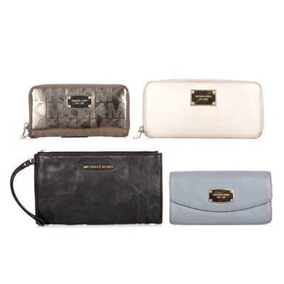 Lot 438 - Michael Kors, three wallets and a wristlet...