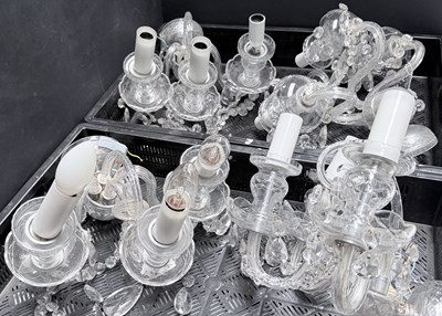 Lot 21 - A set of four cut glass three arm wall sconces...