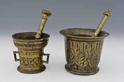 Lot 543 - A cast bronze mortar and pestle, probably...