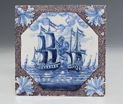 Lot 657 - An English Delft blue and white and magenta...