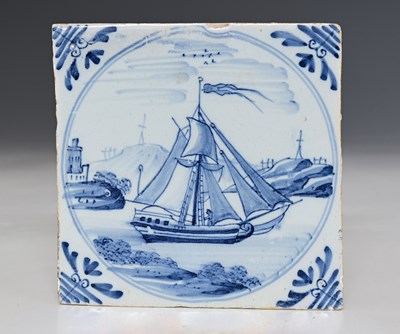 Lot 658 - An English Delft blue and white tile, circa...