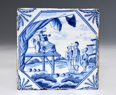 Lot 660 - An English Delft blue and white tile, circa...