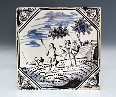 Lot 661 - An English Delft magenta tile, painted with a...