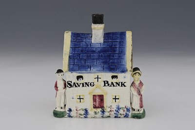 Lot 662 - A Staffordshire pottery Savings Bank cottage...