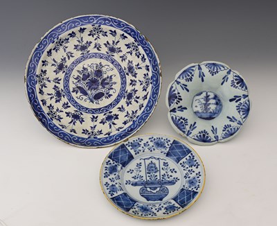 Lot 674 - Three Delft blue and white plates, probably...