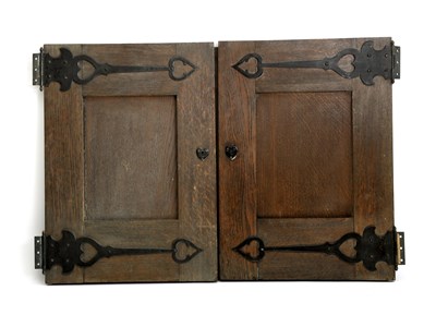 Lot 416 - A set of four oak cabinet doors with Thomas...