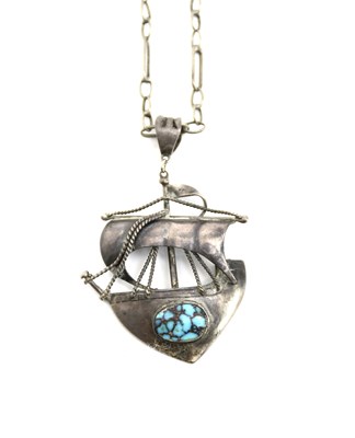 Lot 554 - A silver and turquoise Galleon pendant...