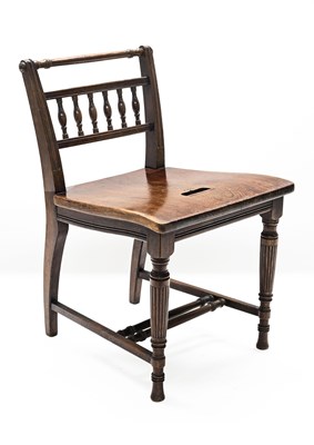 Lot 425 - An oak and pitch pine chair in the manner of...