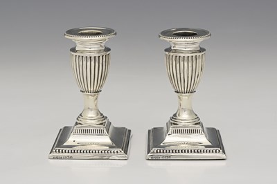 Lot 245 - A pair of Victorian silver dwarf candlesticks,...