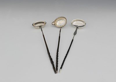 Lot 172 - Three toddy ladles with turned handles, to...
