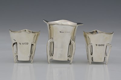 Lot 111 - A group of three silver novelty tot or liqueur...