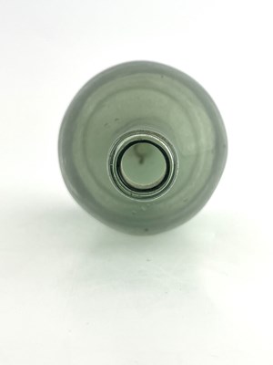 Lot 460 - A small green glass bottle, 18th century,...