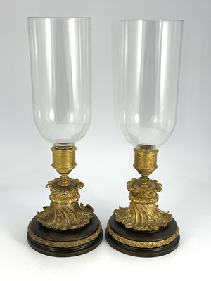 Lot 651 - A pair of French bronze and ormolu storm lamps...