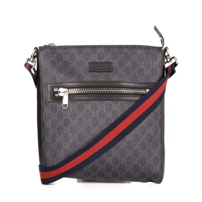 Lot 354 - Gucci, a black supreme messenger bag, crafted...