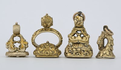 Lot 22 - Four nineteenth-century yellow metal seal fobs,...