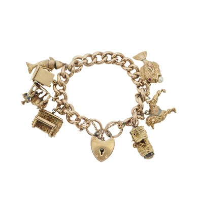 Lot 183 - A charm bracelet and loose charms