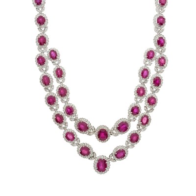 Lot 125 - A graduated oval shape ruby and brilliant-cut diamond cluster line necklace