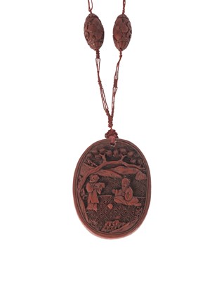 Lot 174 - A Chinese cinnabar lacquer pendant necklace, possibly 18th-19th century