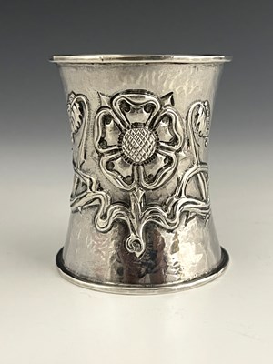 Lot 31 - A George V silver Arts and Crafts napkin ring,...