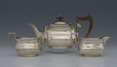 Lot 210 - A George V silver three-piece tea set, by C W...