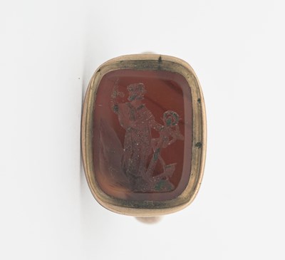 Lot 15 - A nineteenth-century gold-coloured metal fob...