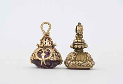 Lot 19 - Two gold seal fobs, one decorated with cage...