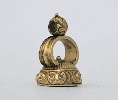 Lot 16 - A nineteenth-century yellow metal fob seal,...