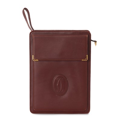 Lot 302 - Cartier, a vintage Bordeaux clutch bag.
