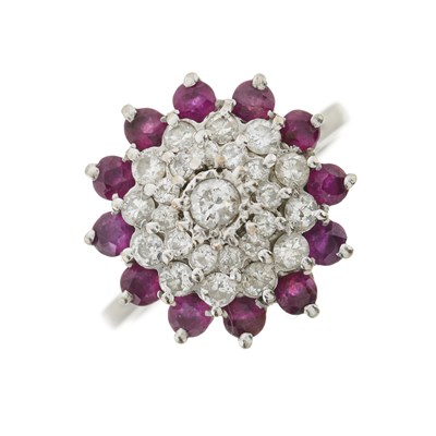 Lot 100 - A brilliant-cut diamond and ruby cluster ring