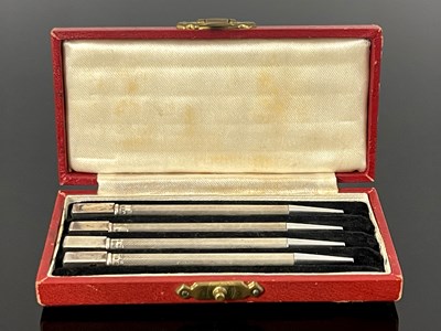 Lot 275 - A cased set of four Art Deco silver bridge...