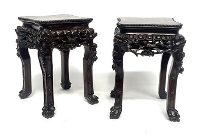 Lot 450 - A pair of small Chinese hardwood vase stands,...