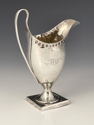 Lot 132 - A George III silver cream jug, of helmet form...