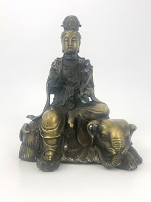 Lot 452 - A cast bronze figure of Guan Yin, modelled...