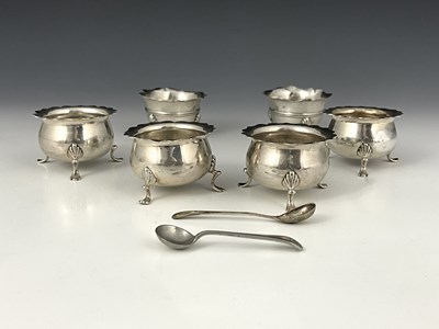 Lot 200 - A set of four Edwardian silver circular salts,...