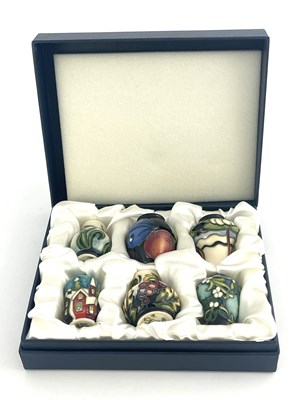 Lot 780 - A set of six Moorcroft Christmas miniature...