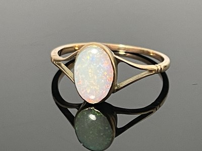 Lot 163 - A yellow metal opal single stone ring, the...