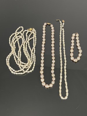 Lot 156 - A three strand cultured pearl necklace with...