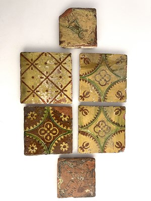 Lot 1007 - A collection of 17th century slip glazed tiles,...