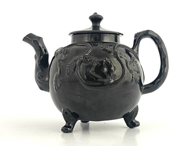 Lot 1039 - A Staffordshire pottery Jackfield teapot or...