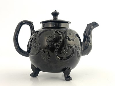 Lot 1039 - A Staffordshire pottery Jackfield teapot or...