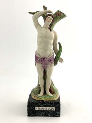 Lot 1018 - A Staffordshire pearlware pottery figure of St...