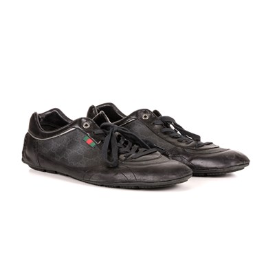 Lot 369 - Gucci, a pair of trainers, crafted from black...