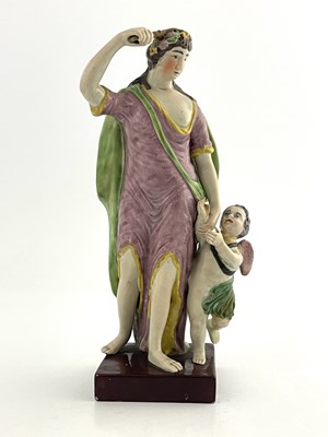 Lot 1033 - A Staffordshire pearlware pottery figure of...