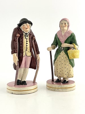 Lot 1041 - A pair of Staffordshire pearlware figures of...