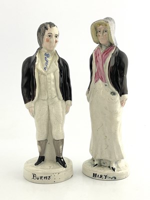 Lot 1043 - A pair of Scottish pottery figures of Robert...