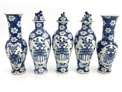 Lot 580 - A Chinese blue and white five piece altar...