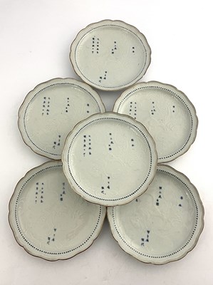 Lot 564 - A set of six Japanese blue and white relief...